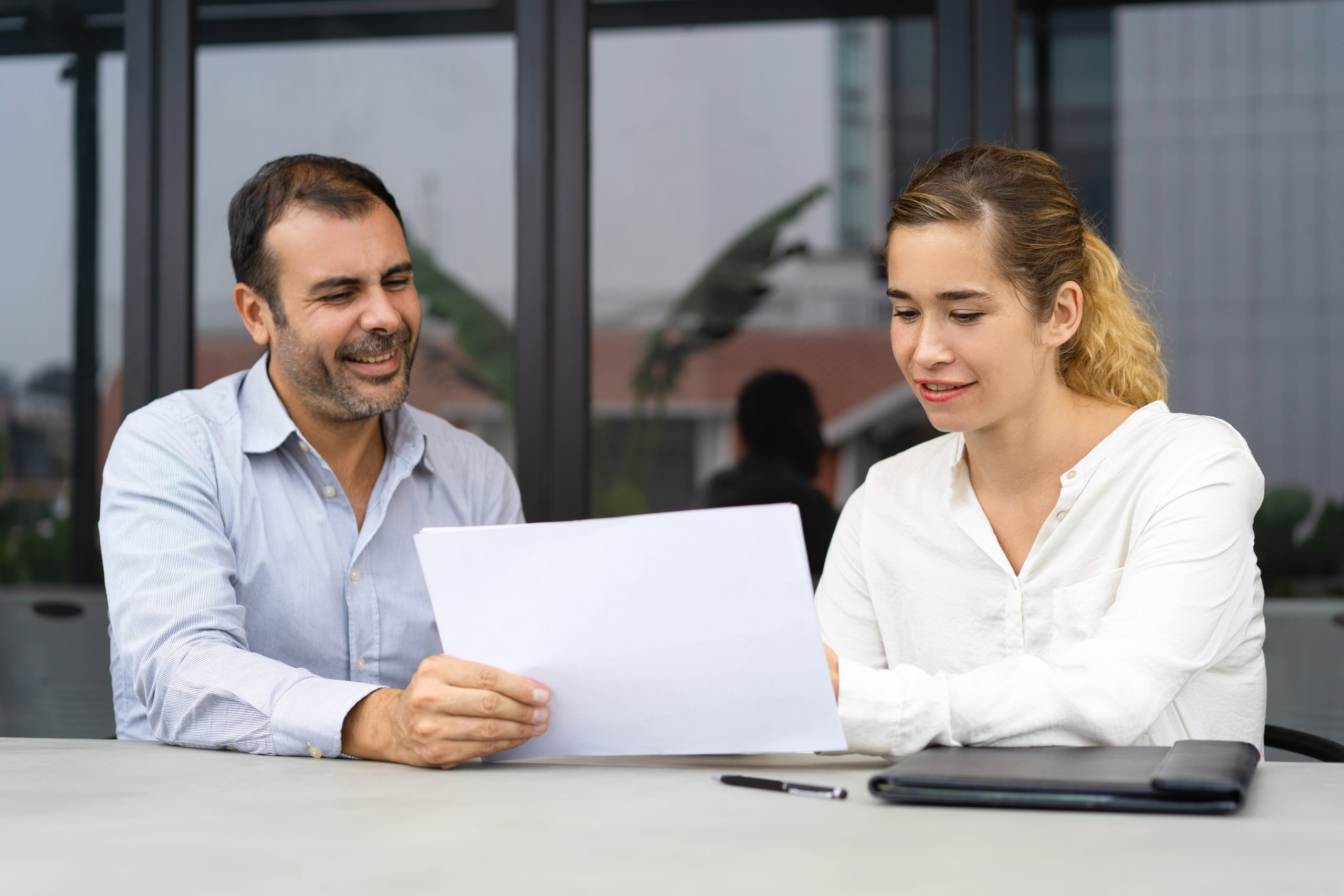 positive businessman asking expert to check documents scaled