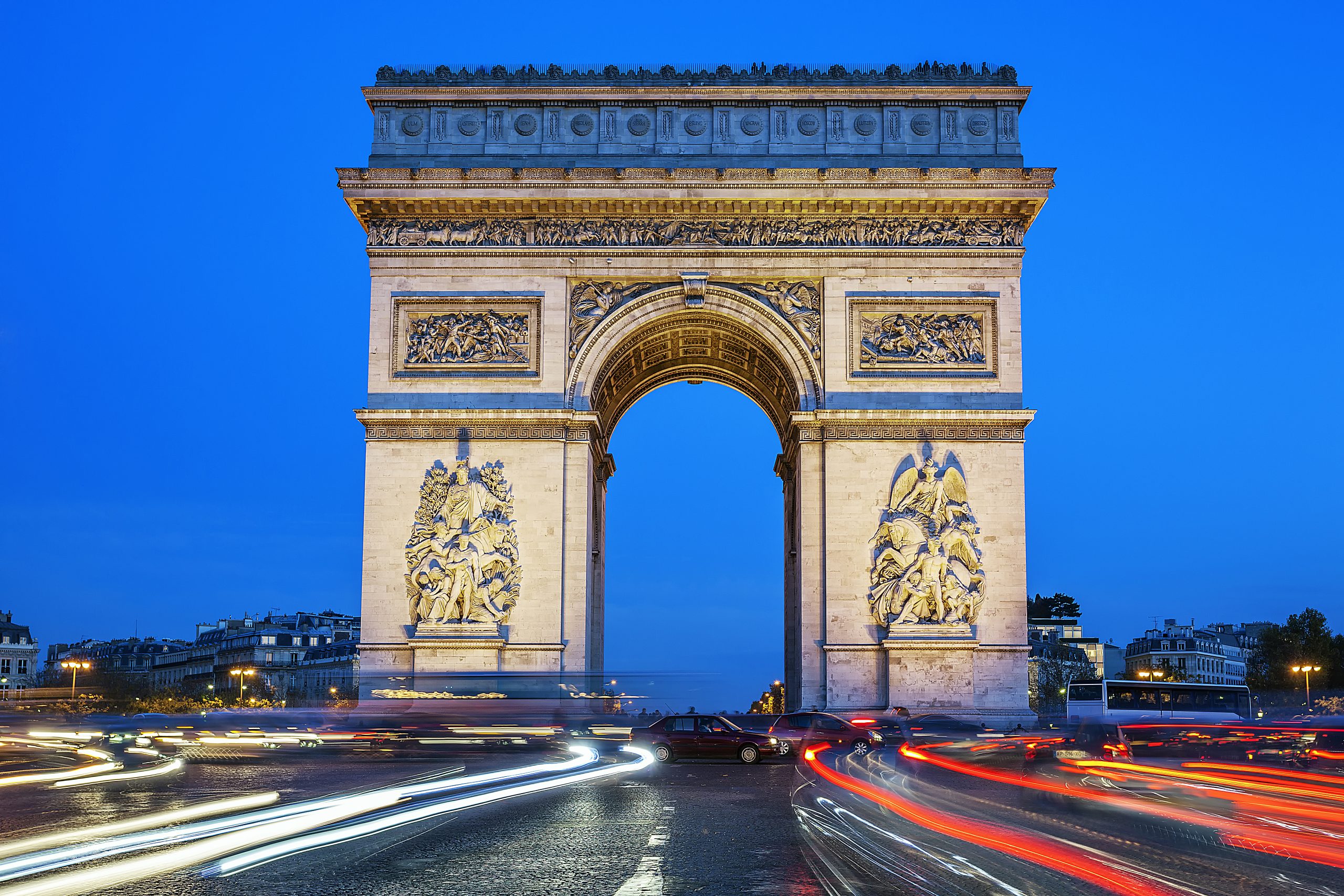 arch of triumph at night paris france scaled