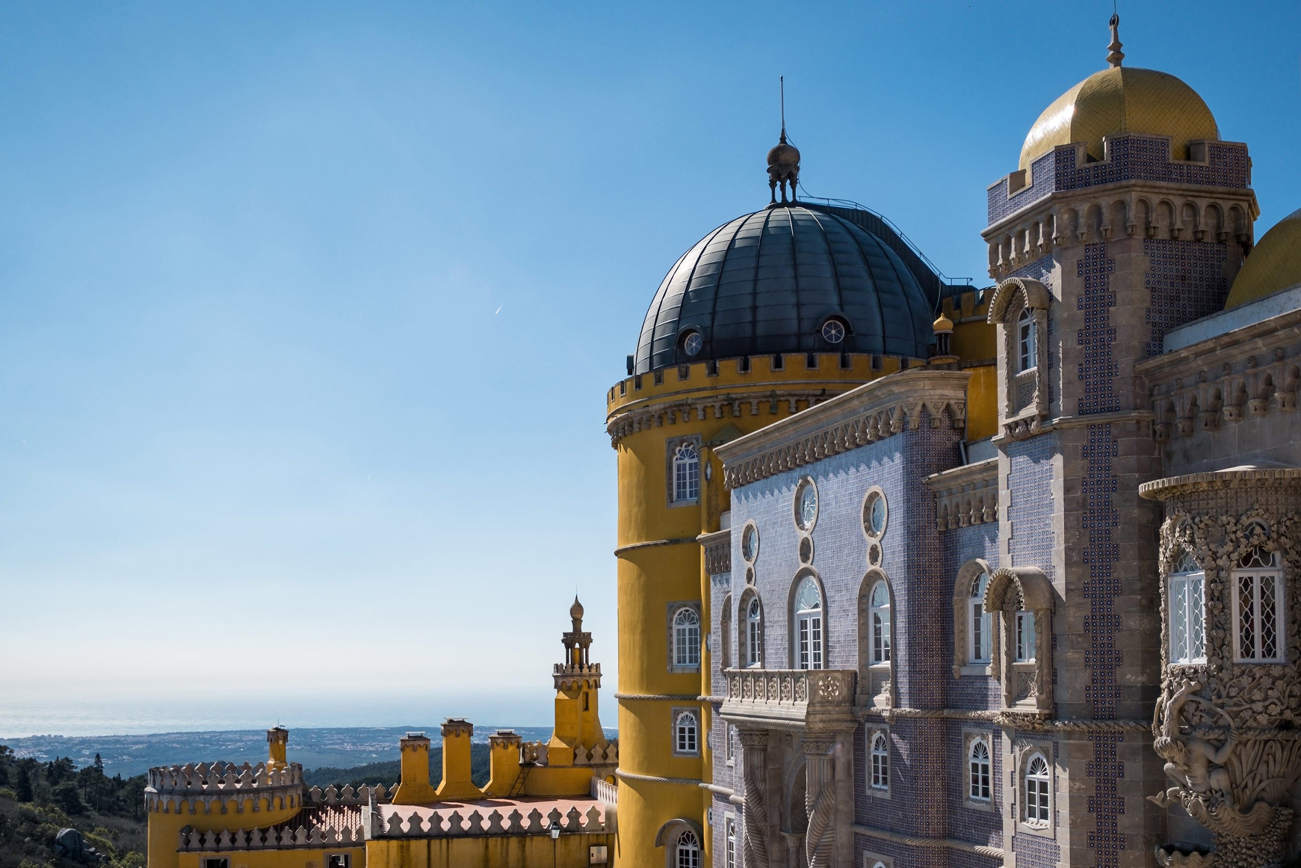 castle in sintra cascais surrounded by greenery under the sunlight and a blue sky in portugal scaled