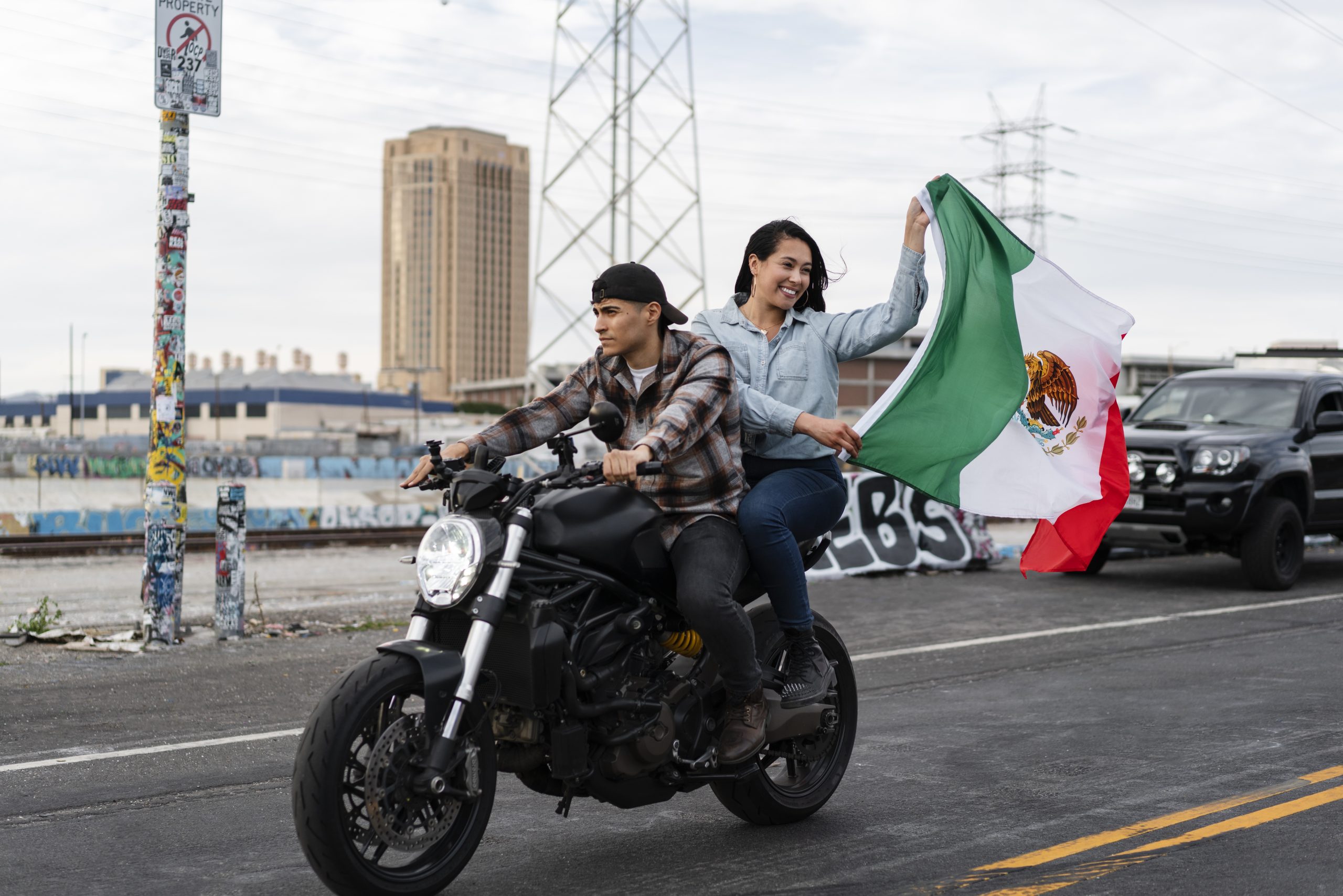 couple on a motorcycle with mexican flag scaled