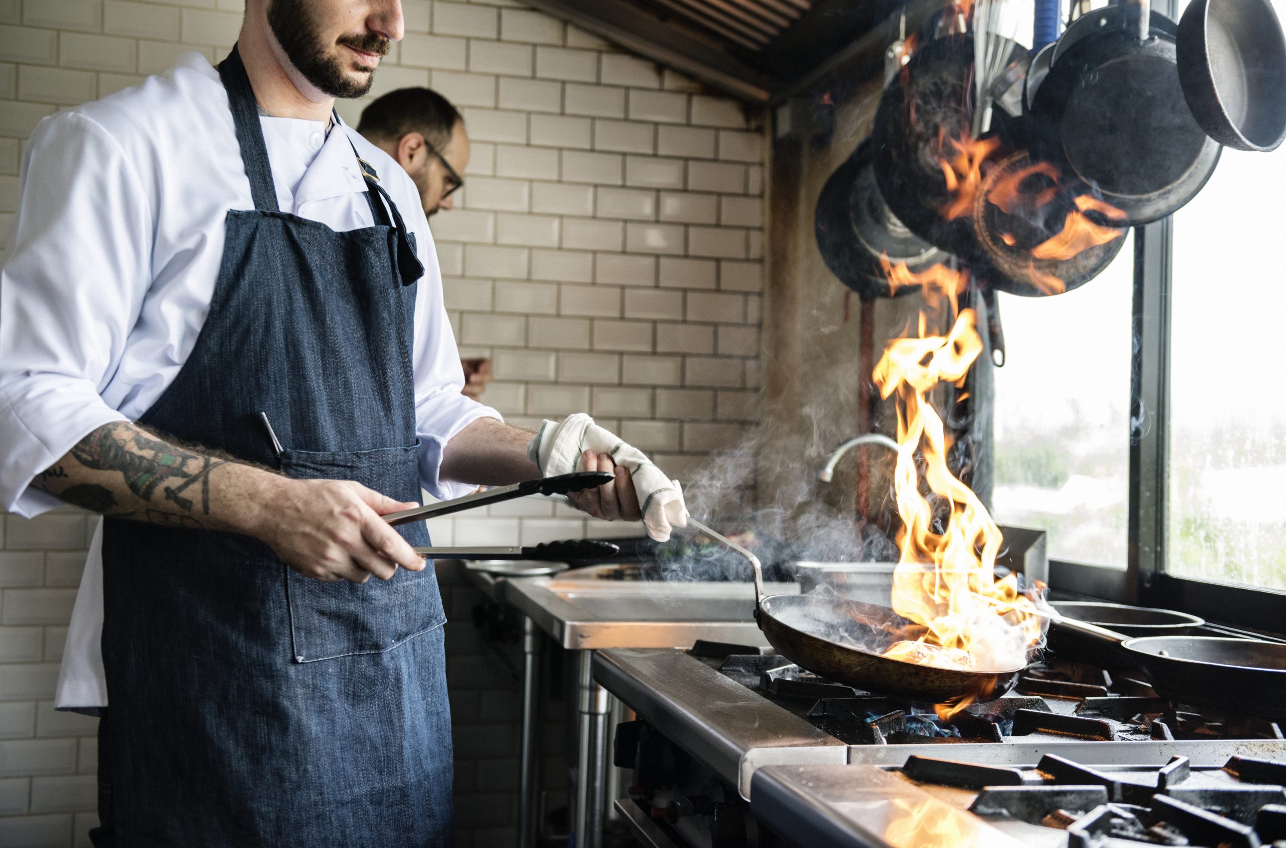 chef cooking food in the restaurant kitchen scaled