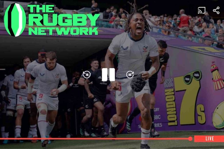 Imagem de partida de rugby com jogadores entrando em campo e destaque para a plataforma The Rugby Network como opção para assistir jogos de rugby online.