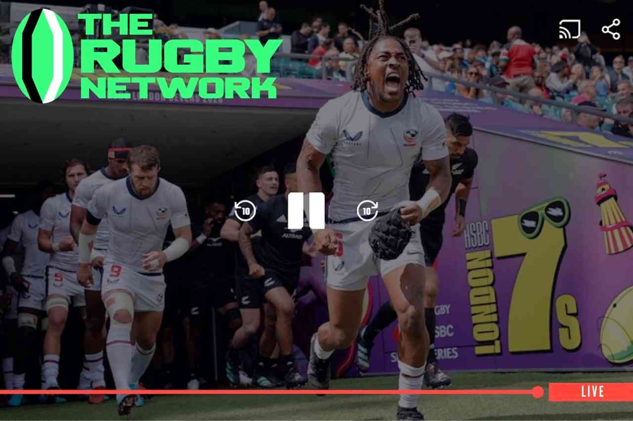 Imagem de partida de rugby com jogadores entrando em campo e destaque para a plataforma The Rugby Network como opção para assistir jogos de rugby online.